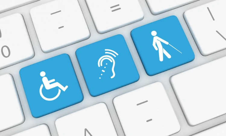 Teclado con teclas azules que representan accesibilidad para personas con discapacidad física, auditiva y visual.